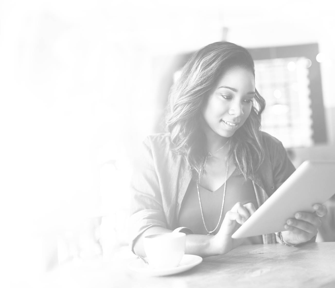 Cropped shot of an attractive young woman using a digital tablet in a cafe